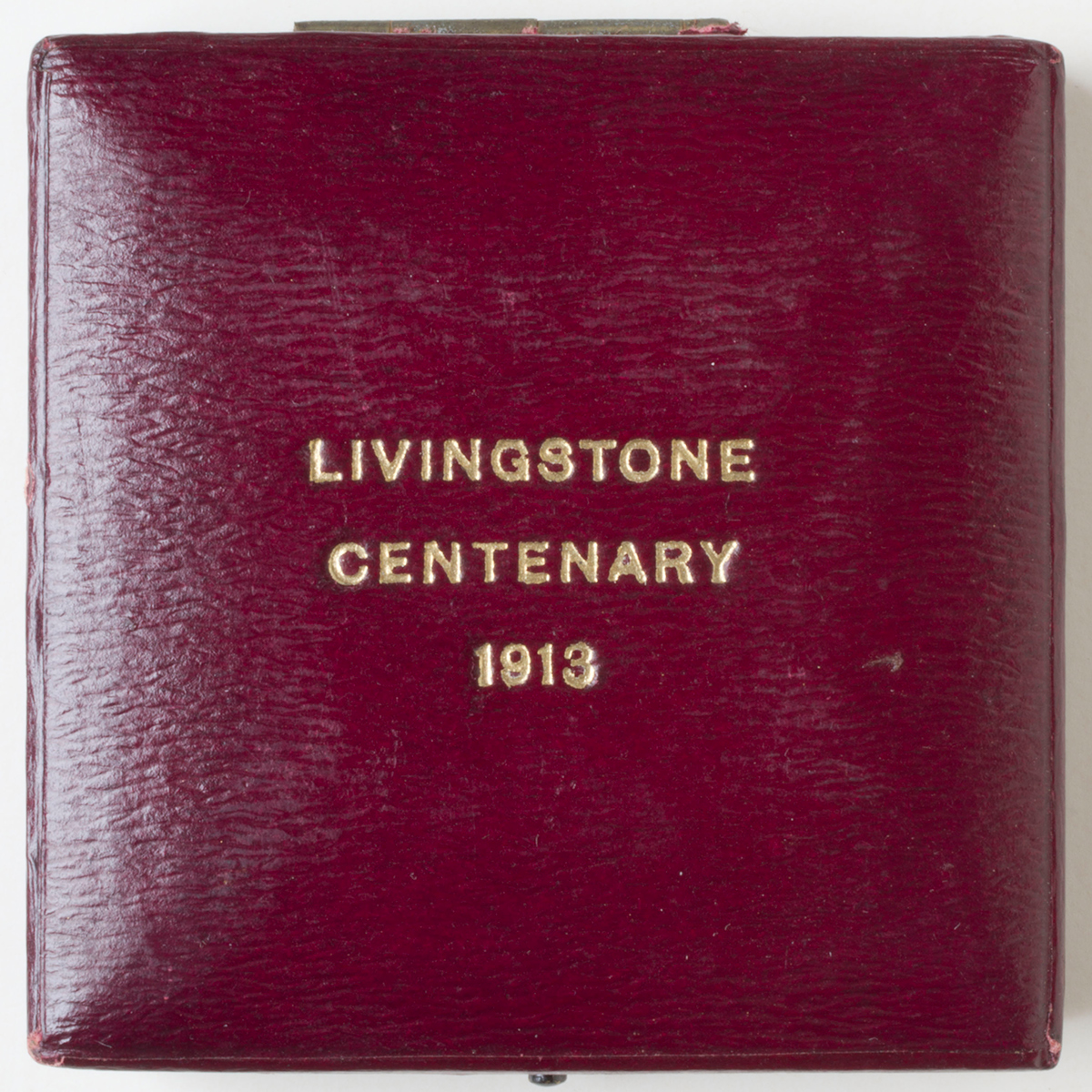 Presentation box containing David Livingstone Centenary Coin, 1913. Copyright David Livingstone Centre. Object images used by permission. May not be reproduced without the express written consent of the National Trust for Scotland, on behalf of the Scottish National Memorial to David Livingstone Trust. Images of the objects from the David Livingstone Centre are copyright Roddy Simpson. Creative Commons Attribution-NonCommercial 3.0 Unported (https://creativecommons.org/licenses/by-nc/3.0/).